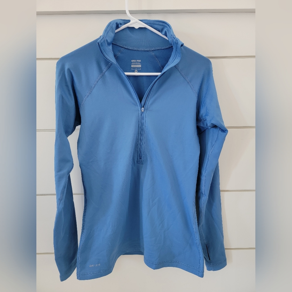 Women's Nike Dri-fit quarter zip pullover in blue. Size Medium